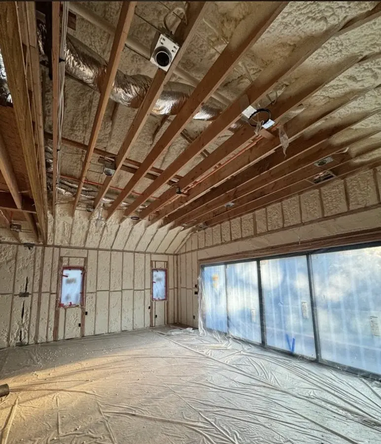 Interior walls and ceiling insulated with spray foam during new construction in Sinton